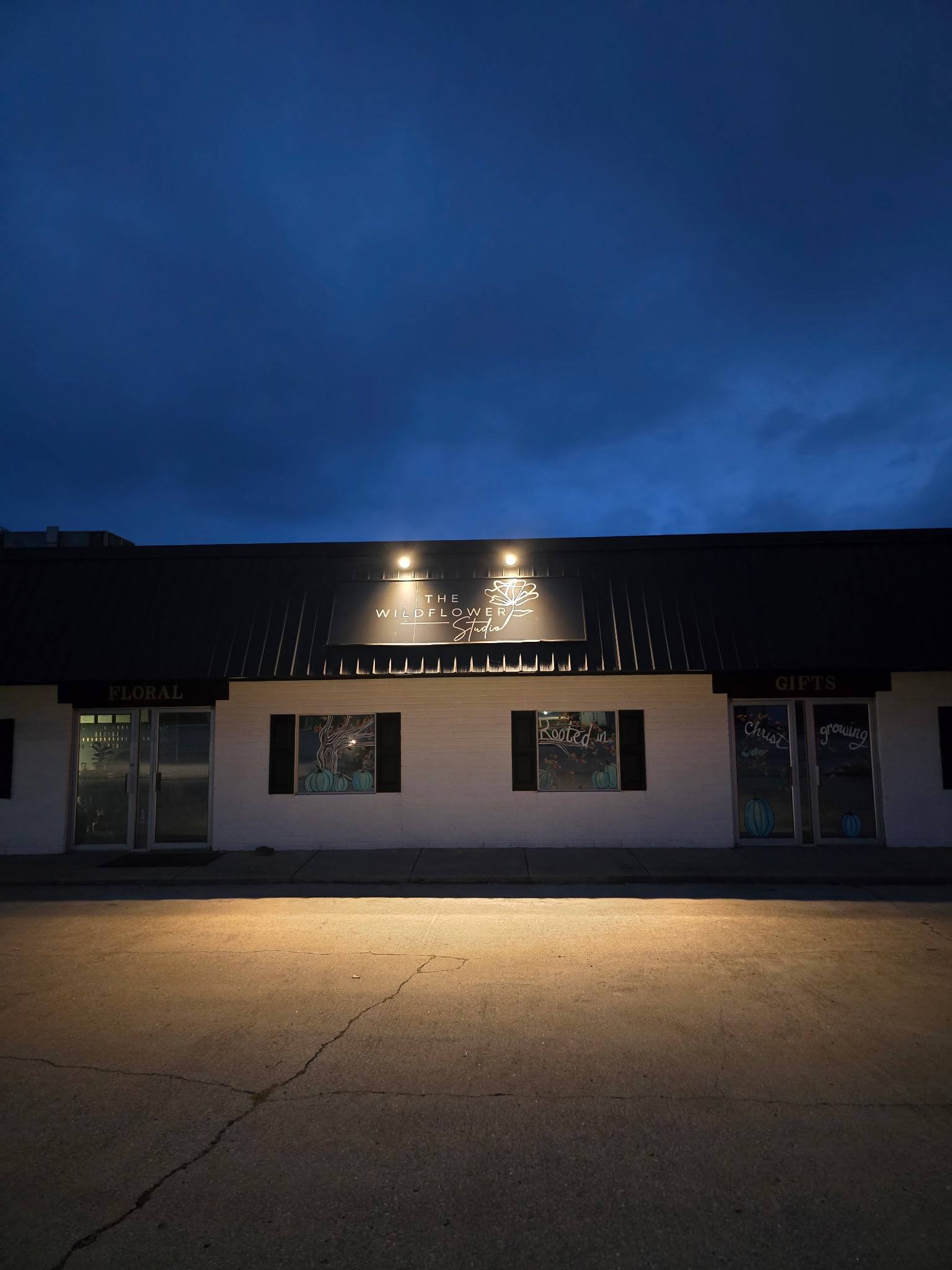 Finished exterior lighting on a commercial building at dusk