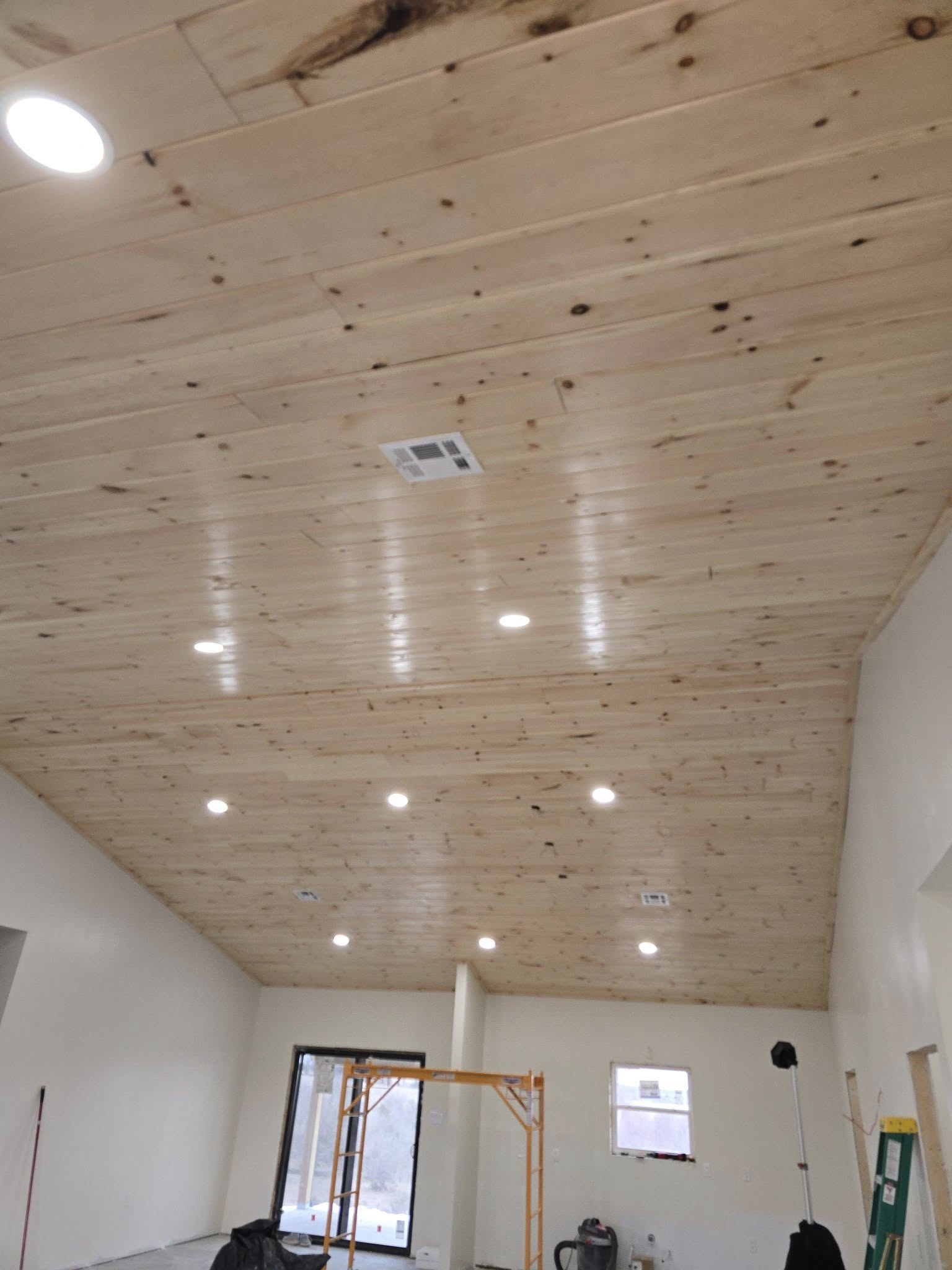 Finished wood ceiling with recessed lighting